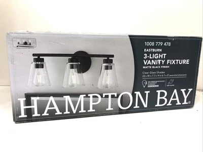 Hampton Bay Eastburn 22 pulgadas Vidrio transparente con luz de tocador negro mate de 3 luces Foto 1 de 3