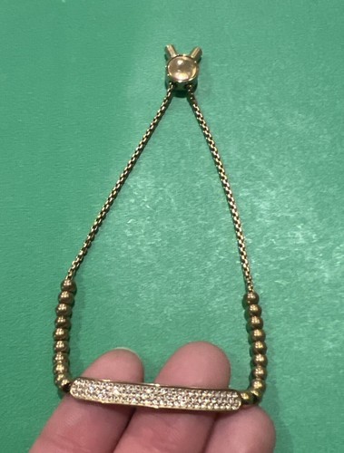 Bracciale cristalli Michael Kors logo placca oro perline cursore