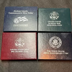 LOT 0F 4 UNCIRCULATED $1 COMMEMORATIVE SILVER DOLLAR COINS BOX COA #670 - Picture 1 of 12