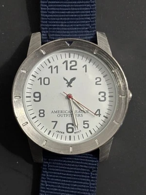 American Eagle Watch Men Silver Tone Blue Slip Thru Nylon Band New Battery 10" - Image 1 of 4