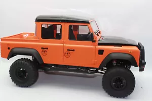 FM 102 Landrover ORANGE Defender Crawler Pickup 4WD RTR 1:8 RC Auto NEU OVP - Bild 1 von 18