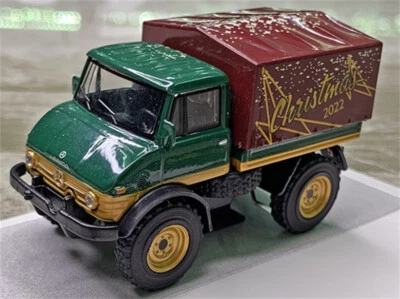 1:64 scale Truck Model Schuco MB For Unimog U 406 Christmas version toys Collect - Image 1 of 4