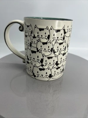 Taza Spectrum Designz negra/blanca cara de gato turquesa 16 OZ Foto 1 de 4