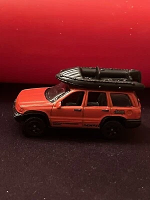 Matchbox 1999 Jeep Grand Cherokee 4x4 Red Diecast w/ Rubber Raft USED NM Cond - Image 1 of 4