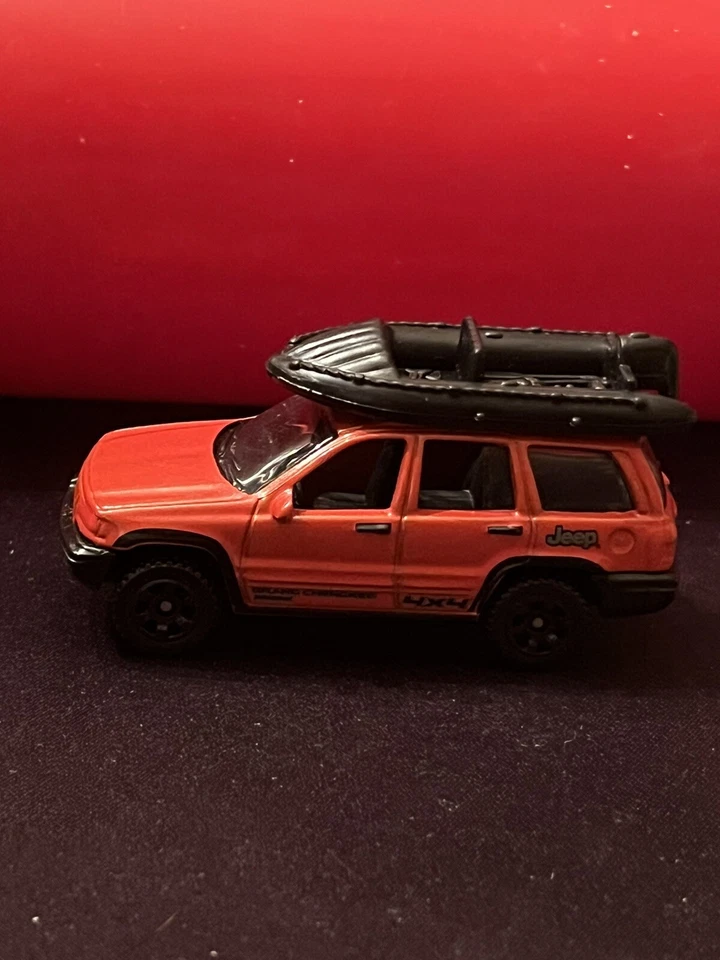 Matchbox 1999 Jeep Grand Cherokee 4x4 Red Diecast w/ Rubber Raft USED NM Cond - Image 1 of 4