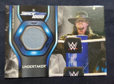 Tarjeta reliquia mate usada evento Smackdown WWE 2019 MR-UT Undertaker Foto 1 de 2