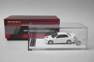 M64003 MOTORHELIX 1:64 Mitsubishi Lancer Evolution IV SCOTIA BLANCO - Imagen 1 de 11