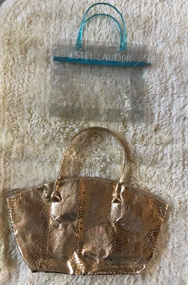 ** 2 TOTES -- ELIZABETH ARDEN DORADO METÁLICO Y ESTEE LAUDER PLÁSTICO TRANSPARENTE - ¡NUEVO! ** Foto 1 de 4