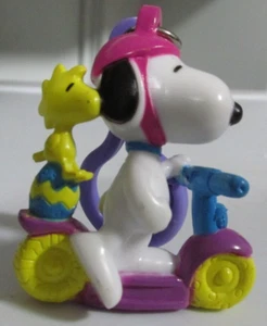 Snoopy Peanuts Easter PVC Figurine Whitman's Scooter Clip On Purple - Picture 1 of 1