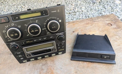 2001-2005 Lexus IS300 Headunit/AC Controls + Traction Control Bezel w/ Button - Image 1 of 4