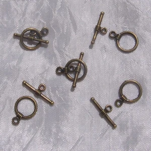LOT de 12 sets de FERMOIRS BRONZE TOGGLE 11x16mm / 19x6mm ROND ET BARRE  - J142 - Picture 1 of 3