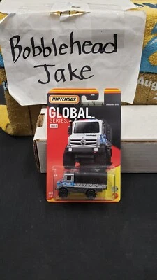 NIB 2022 MECEDES BENZ UNIMOG U 5023 POLICE MATCHBOX GLOBAL SERIES 1/64 #10/12 - Image 1 of 4