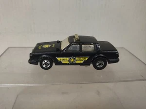 STATE-POLICE BLACK FLIPPER FLIP-OUTS 1:64 HOT WHEELS HONG KONG NO BOX - Imagen 1 de 7