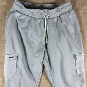 Pantalones deportivos Under Armour para hombre pequeños azul claro calce suelto - Imagen 1 de 11