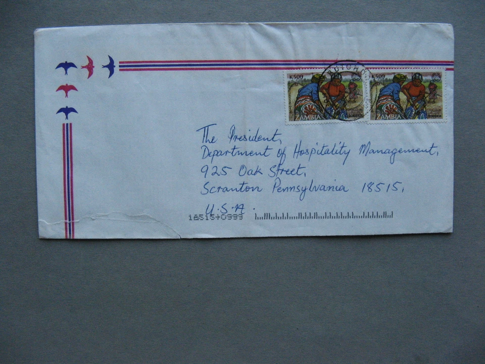 ЗАМБИЯ, обложка в США 1999, 2 переоцененные марки с надпечаткой МОТ, канк Бутондо - Изображение 1 из 1