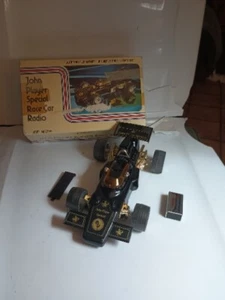 Vintage #22846 JOHN PLAYER SPECIAL Black Plastic LOTUS Race Car AM RADIO Works - Picture 1 of 15