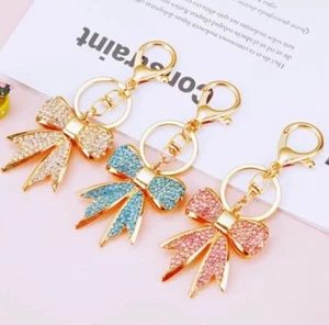 Bellissimo portachiavi con fiocco strass oro portachiavi zaino ciondolo - Foto 1 di 3