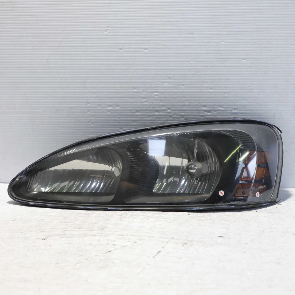 Левосторонняя галогенная фара в сборе для Pontiac Grand Prix 2004-2008 годов выпуска от оригинального производителя - Изображение 1 из 4