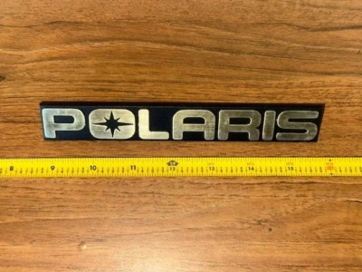 Polaris 5430685 New OEM Snowmobile ATV PWC Hood Emblem GOLD - Image 1 of 2