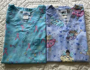 Scrub Tops Womans Size M “Simply Basic” Set Of 2 Fairies/Pink Ribbons - Picture 1 of 6
