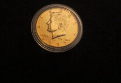 *** 1997 ***JFK ***GOLD PLATED ***HALF DOLLAR COIN***UNCIRCULATED***IN A CAPSULE - Image 1 of 2