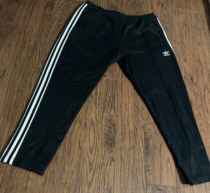 Adidas Firebird Trainingshose Herren M schwarz Reißverschlusstaschen gesticktes Trefoil Logo - Bild 1 von 8