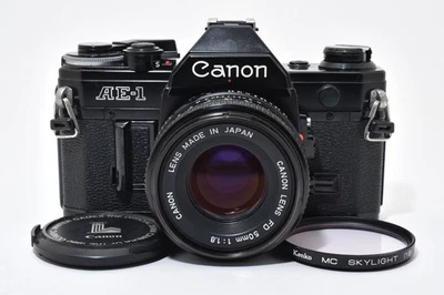[Exc+5] Cámara fotográfica Canon AE-1 35 mm con lente nueva FD 50 mm f1,8 de Japón 6576 Foto 1 de 4