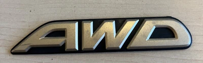 Subaru OEM 2000-2003 Outback Limited "AWD" Gold Rear Trunk Lid Emblem Logo Badge - Image 1 of 2