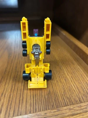Coche de carreras amarillo de colección Transformers 1985 G1 Stunticons Menasor tira de arrastre Foto 1 de 4