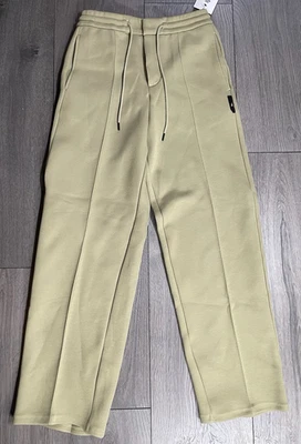 Pantalones deportivos Nike Tech de vellón a medida con dobladillo abierto Olive Aura FZ7583-276 para hombre talla S” Foto 1 de 3