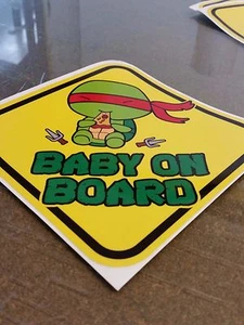 Teenage Mutant Ninja Turtles RAPHAEL CHIBI Cute BABY ON BOARD STICKER WARNING - Bild 1 von 1
