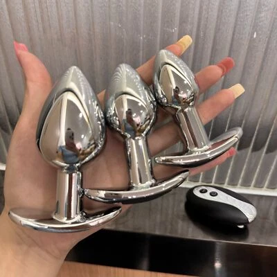 Consolador anal vibrador de metal con control remoto juguetes sexuales para hombres mujeres Foto 1 de 4