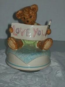 PORCELAIN BEAR HOLDING SIGN "LOVE YOU" MUSIC BOX PLAYS "LOVE MAKES THE WORLD GO  - Picture 1 of 6