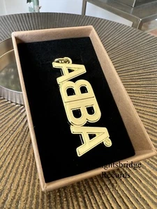 ABBA Official Limited Edition Gold Heavyweight Keyring Voyage - Picture 1 of 4