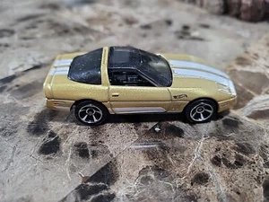 2023 Hot Wheels The '80s '84 C4 Chevrolet Corvette Gold - Picture 1 of 6