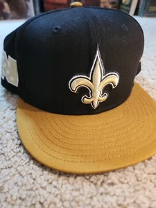 NEW ORLEANS SAINTS New Era Snapback Hat Cap Old Stock NWOT Black Gold ๐๐ค๐ - Picture 1 of 12