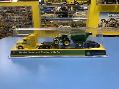 ERTL TOMY JOHN DEERE   YELLOW HAULER SEMI AND  TRACTOR  WITH  CART NEW - Image 1 of 4