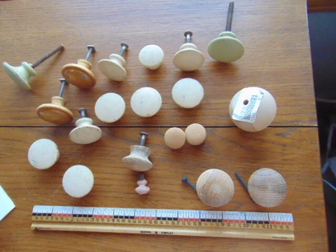 Older 20 wood knobs- some are painted- various sizes Cover
