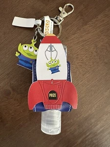 Disney Parks Pixar Pizza Planet Green Aliens Sanitizer & Holder Keychain 1 fl oz - Picture 1 of 3