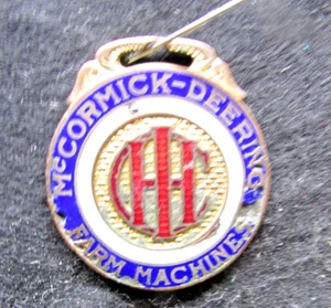 NEUES ANGEBOT - Vintage Uhrenanhänger - McCormick-Deering Farm Machine (369 - Bild 1 von 4