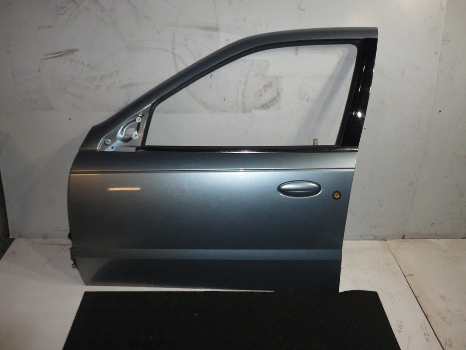 Saturn L300 2005 sedán puerta delantera izquierda lado del conductor carcasa azul hielo 42U U 725H Foto 1 de 4