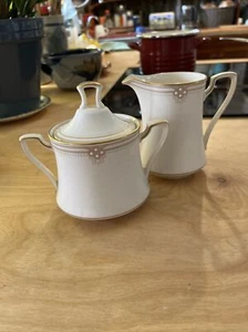 VESTIDO DE SATÉN CREMA Y AZÚCAR NORITAKE - Imagen 1 de 4