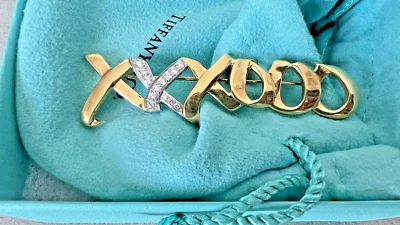 Broche prendedor Tiffany & co Paloma Picasso oro 18kt y plata diamante XOXO abrazos besos  Foto 1 de 4