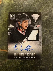2013-14 Panini Titanium Auto Rookie Worn Gear True RPA RC /15 SSP Elias Lindholm - Bild 1 von 2