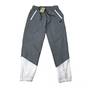 Pantalones de chándal Nike Windrunner tejidos forrados para hombre talla M, L, XL, XXL gris humo/blanco nuevos con etiquetas - Imagen 1 de 10