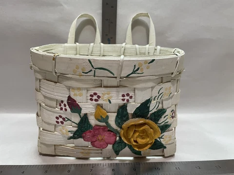 vintage white woven hanging basket with floral details Cover