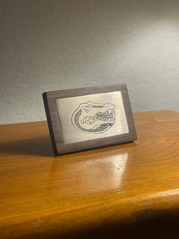 hand engraved metal plate set in desert ironwood Cover