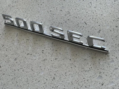 1984 1985 MERCEDES 500 SEC COUPE TRUNK EMBLEM BADGE FACTORY 126 817 10 15 OEM🟠 - Image 1 of 4
