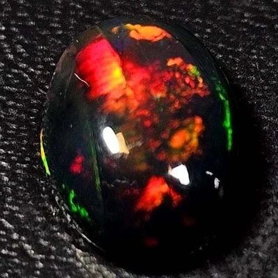 NATURAL AAA+FULLFIRE COLOR PLAY OVAL CABOCHAN  ETHIOPIAN WELO BLACK OPAL 1.00CTS - Image 1 of 3