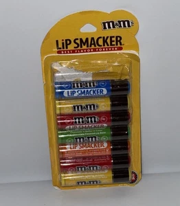 Siehe Fotos Party Pack 7 bunte Lip Smacker M&M’s Lippenbalsam mit Schokoladengeschmack - Bild 1 von 3